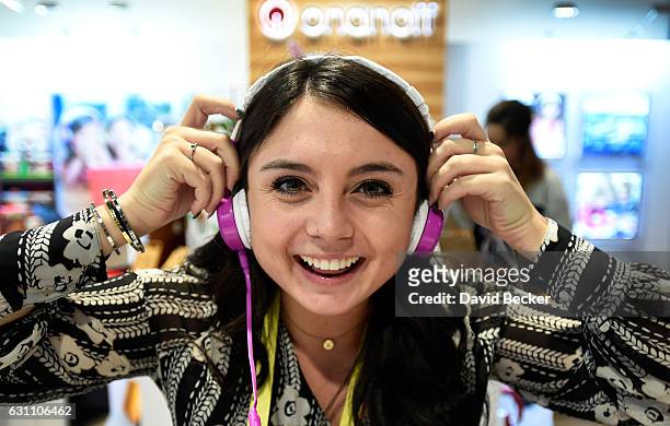 Onanoff representative Angela Lucarelli wears the Buddyphones at CES 2017 at the Las Vegas Convention Center on January 6, 2017 in Las Vegas, Nevada....