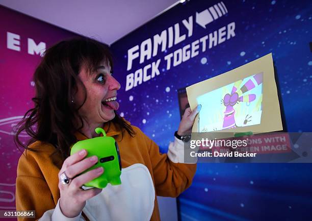 Cinemood representative Anna-Bel Jean demonstrates the Storyteller, a mini cinema projector at CES 2017 at the Las Vegas Convention Center on January...