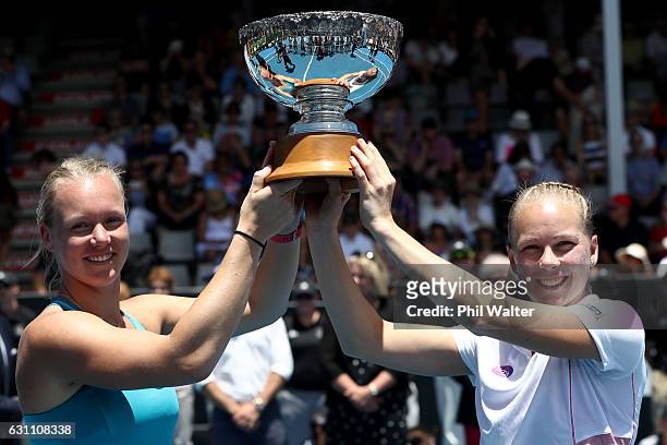 Kiki Bertens of the Netherlands and Johanna Larsson of Sweden hold the trophy after winning the womens doubles final against Demi Schuurs of the...