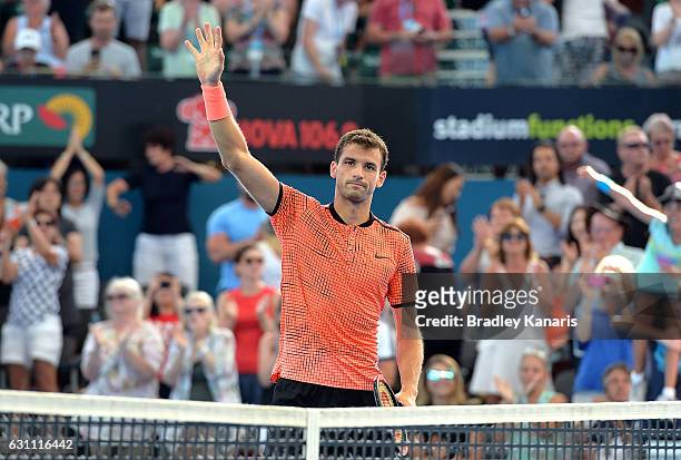 Grigor Dimitrov of Bulgaria celebrates victory against Milos Raonic of Canada after their semi final match on day seven of the 2017 Brisbane...
