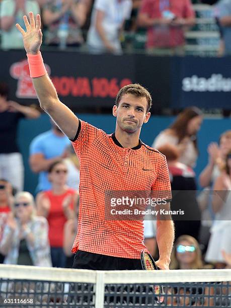 Grigor Dimitrov of Bulgaria celebrates victory against Milos Raonic of Canada after their semi final match on day seven of the 2017 Brisbane...