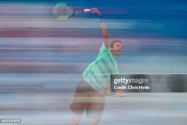 Milos Raonic of Canada serves against Grigor Dimitrov of Bulgaria during their semi final match during day seven of the 2017 Brisbane International...
