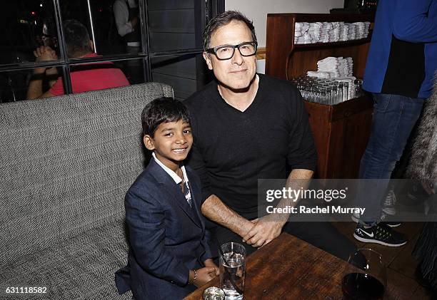 Actor Sunny Pawar and David O'Russell attend a special screening and reception of "LION" hosted by David O'Russell and Lee Daniels celebrating...