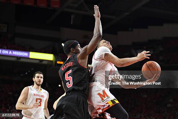 Maryland Terrapins guard Anthony Cowan is fouled by Nebraska Cornhuskers guard Glynn Watson Jr. In the first half at Xfinity Center January 01, 2017...