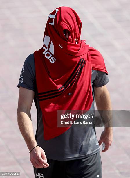 Franck Ribery hides under a jacket after a training session at day 5 of the Bayern Muenchen training camp at Aspire Academy on January 7, 2017 in...