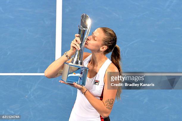 Karolina Pliskova of the Czech Republic celebrates victory as she kisses winners trophy after her match against Alize Cornet of France during the...