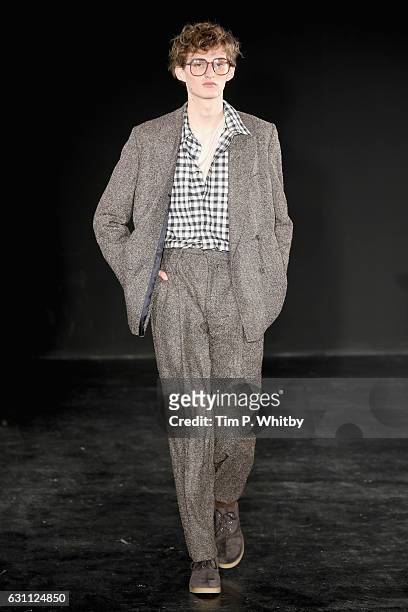 Model walks the runway at the E.Tautz show during London Fashion Week Men's January 2017 collections at BFC Presentation Space on January 7, 2017 in...