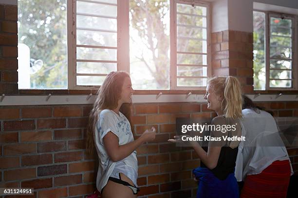 girls chatting and lauging in changing room - locker room wall stock pictures, royalty-free photos & images