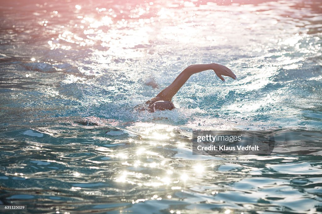 Swimmer doing crawl stroke