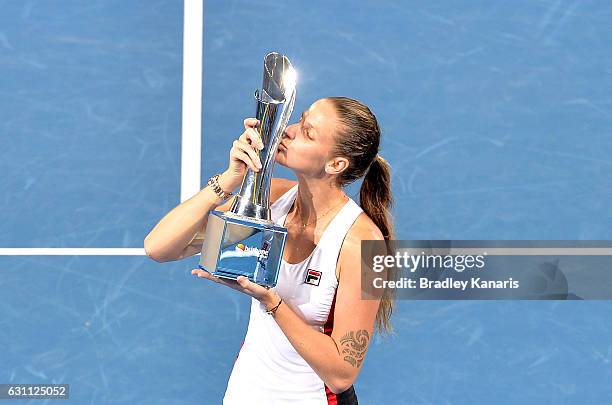 Karolina Pliskova of the Czech Republic celebrates victory as she kisses the winners trophy after her match against Alize Cornet of France during the...