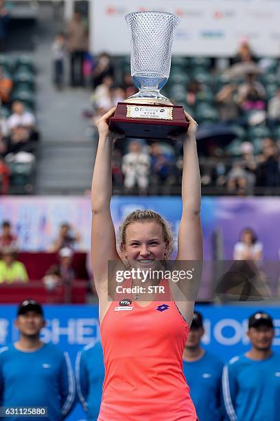 Katerina Siniakova of the Czech Republic poses with her trophy after winning the women's singles final match against Alison Riske of the US at the...