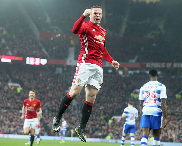 Wayne Rooney of Manchester United celebrates scoring their first goal and equalling Sir Bobby Charlton's club goals record of 249 during the Emirates...
