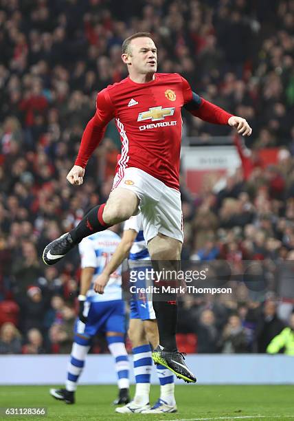 Wayne Rooney of Manchester United celebrates as he scores his sides first goal during the Emirates FA Cup third round match between Manchester United...