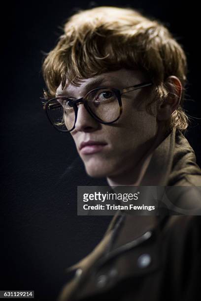 Model backstage ahead of the E.Tautz show during London Fashion Week Men's January 2017 collections at BFC Backstage Space on January 7, 2017 in...