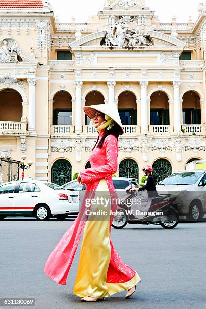 woman in traditional clothes , saigon, hcm city - vietnam ao dai imagens e fotografias de stock