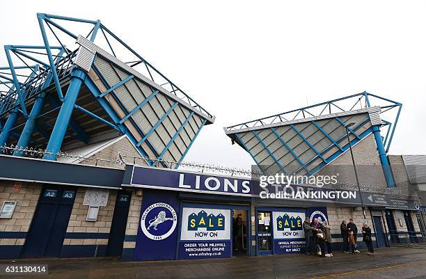 Supporters gather outside the club shop ahead of the English FA Cup third round football match between Millwall and Bournemouth at The Den in south...