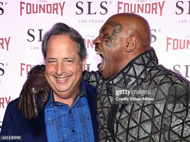 Comedian/actor Jon Lovitz and former boxer Mike Tyson joke around as they arrive at the kickoff of Lovitz's 20-show residency "Reunited" with Dana...