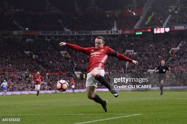 Manchester United's English striker Wayne Rooney shoots but fails to score during the English FA Cup third round football match between Manchester...