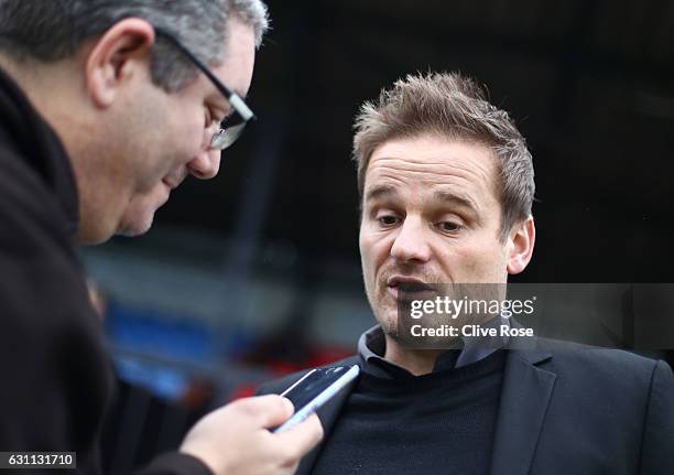 Neal Ardley manager of AFC Wimbledon is interviewed prior to The Emirates FA Cup Third Round match between Sutton United and AFC Wimbledon at the...