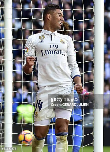 Real Madrid's Brazilian midfielder Casemiro celebrates after scoring during the Spanish league football match Real Madrid CF vs Granada FC at the...