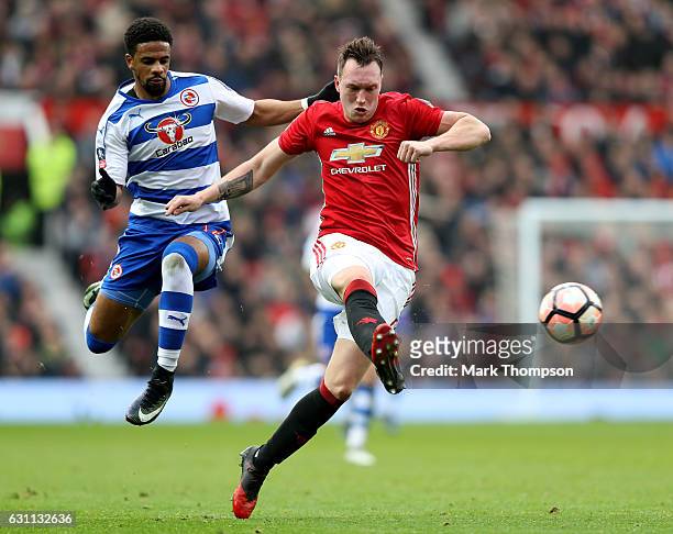 Phil Jones of Manchester United is closed down by Garath McCleary of Reading during the Emirates FA Cup third round match between Manchester United...