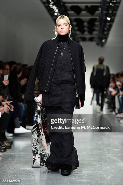 Model walks the runway at the Matthew Miller show during London Fashion Week Men's January 2017 collections at BFC Show Space on January 7, 2017 in...