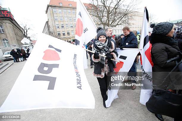 People are seen at a rally against racial violence in Poznan on 7 January, 2017. Recent incidents involving violence against ethnic minorities and...