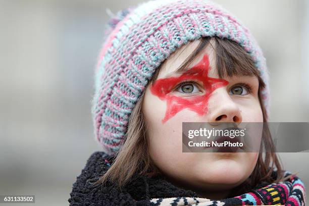 People are seen at a rally against racial violence in Poznan on 7 January, 2017. Kika, a young girl is seen at the rally speaking about her Ukrainian...