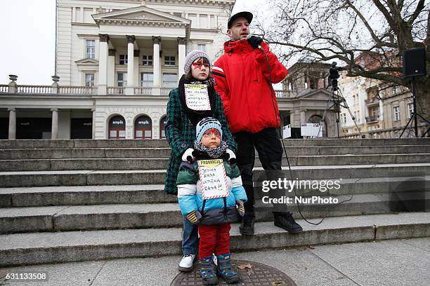 People are seen at a rally against racial violence in Poznan on 7 January, 2017. Kika, a young girl is seen at the rally speaking about her Ukrainian...