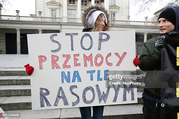 People are seen at a rally against racial violence in Poznan on 7 January, 2017. Recent incidents involving violence against ethnic minorities and...