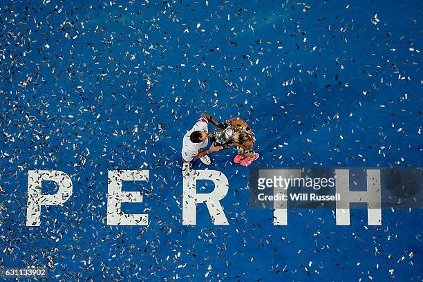 Richard Gasquet and Kristina Mladenovic of France hold kiss the Hopman Trophy after defeating Coco Vandeweghe and Jack Sock of the United States in...