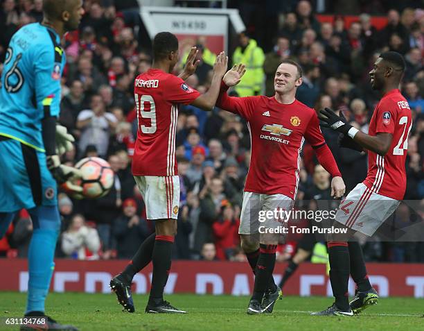 Marcus Rashford of Manchester United celebrates scoring their fourth goal during the Emirates FA Cup Third Round match between Manchester United and...