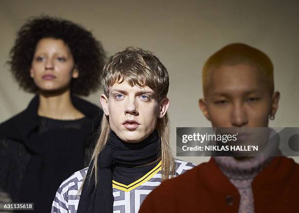 Models present creations by fashion house You Must Create during a presentation on the second day of the Autumn/Winter 2017 London Fashion Week Men's...