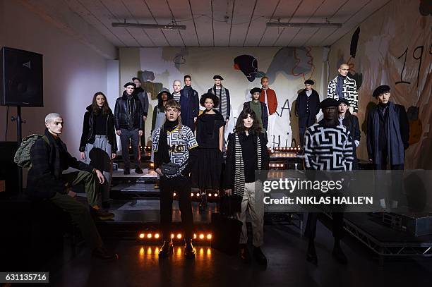 Models present creations by fashion house You Must Create during a presentation on the second day of the Autumn/Winter 2017 London Fashion Week Men's...