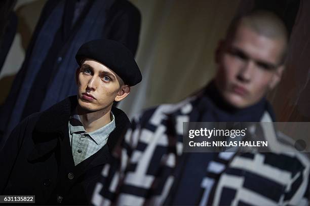 Models present creations by fashion house You Must Create during a presentation on the second day of the Autumn/Winter 2017 London Fashion Week Men's...