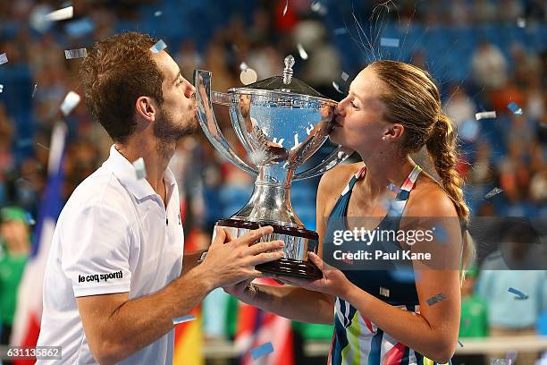 Richard Gasquet and Kristina Mladenovic of France kiss the Hopman Cup trophy after winning the final against Coco Vandeweghe and Jack Sock of the...