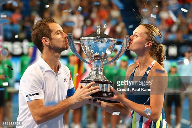 Richard Gasquet and Kristina Mladenovic of France kiss the Hopman Cup trophy after winning the final against Coco Vandeweghe and Jack Sock of the...