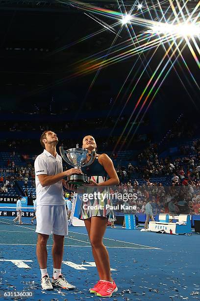 Richard Gasquet and Kristina Mladenovic of France hold the Hopman Cup trophy after winning the final against Coco Vandeweghe and Jack Sock of the...