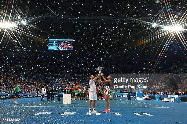 Richard Gasquet and Kristina Mladenovic of France hold the Hopman Cup trophy after winning the final against Coco Vandeweghe and Jack Sock of the...