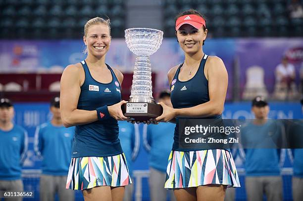 Andrea Hlavackova of the Czech Republic and Peng Shuai of China pose for photo after winning the doubles final match against Raluca Olaru of Romania...