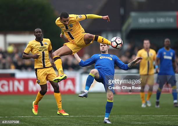 Craig Eastmond of Sutton United acrobatically kicks the ball during The Emirates FA Cup Third Round match between Sutton United and AFC Wimbledon at...