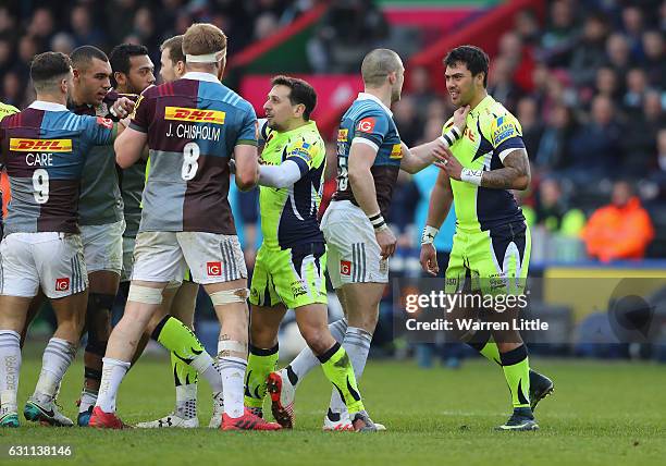 Mike Brown of Harlequins confronts Denny Solomona of Sale Sharks, after a tackle which left team mate Nick Evans of Harlequins not playing any futher...