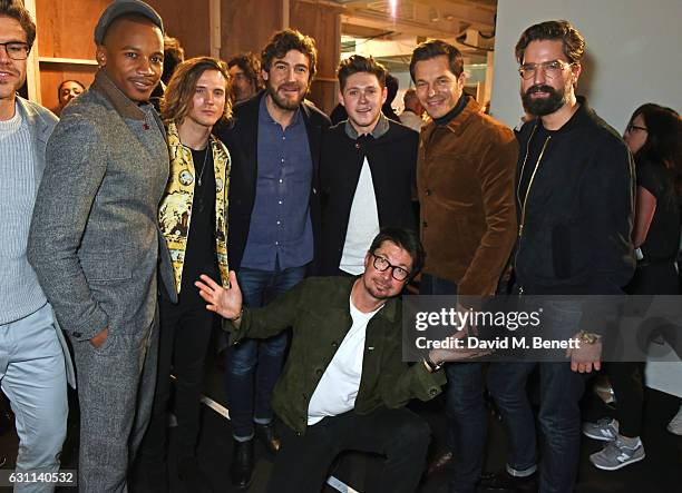 Oliver Spencer poses with Eric Underwood, Dougie Poynter, Robert Konjic, Niall Horan, Paul Sculfor and Jack Guinness backstage at the Oliver Spencer...