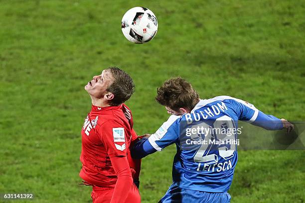 Artjoms Rudnevs of Koeln is challenged by Maxim Leitsch of Bochum during a friendly match between VfL Bochum and 1. FC Koeln at Vonovia Ruhrstadion...