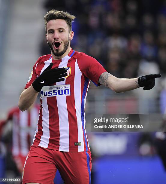 Atletico Madrid's midfielder Saul Niguez celebrates after scoring his team's first goal during the Spanish league football match SD Eibar vs Club...