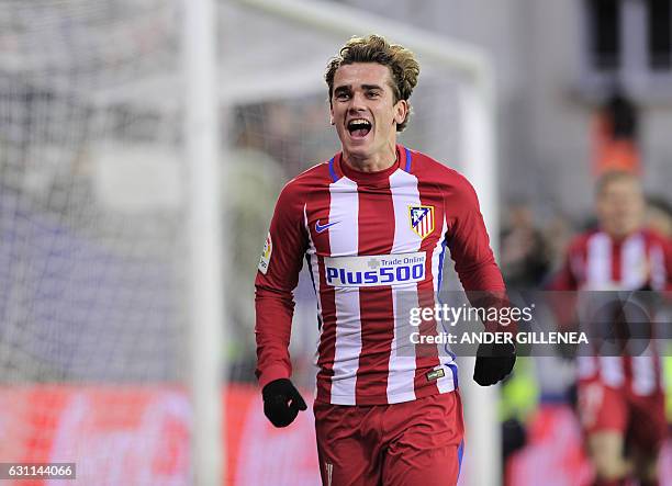 Atletico Madrid's French forward Antoine Griezmann celebrates after scoring his team's second goal during the Spanish league football match SD Eibar...