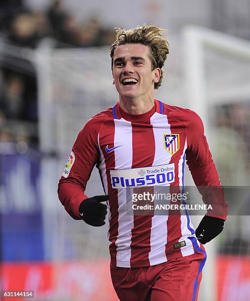 Atletico Madrid's French forward Antoine Griezmann celebrates after scoring his team's second goal during the Spanish league football match SD Eibar...