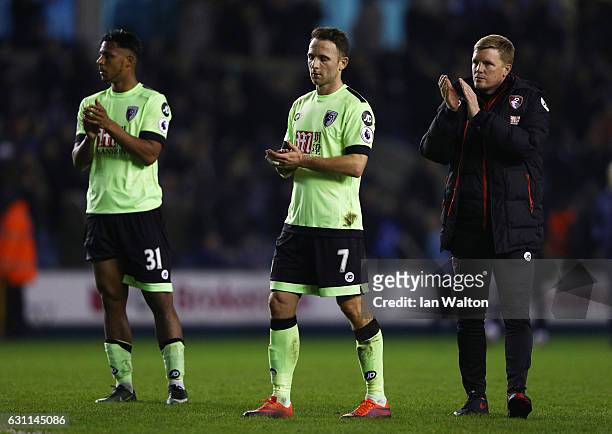 Lys Mousset, Marc Pugh and Eddie Howe manager of AFC Bournemouth react during the Emirates FA Cup third round match between Millwall and AFC...