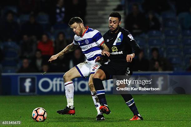 Jamie Mackie of Queens Park Rangers holds off the challenge of Derrick Williams of Blackburn Rovers during the Emirates FA Cup Third Round match...