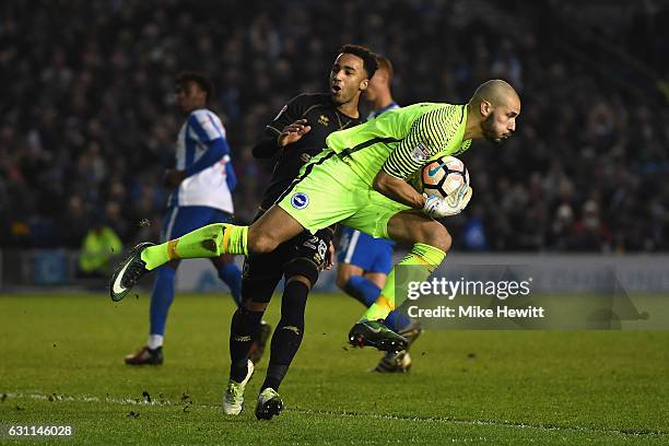 Niki Maenpaa of Brighton denies Nicky Maynard of MK Dons during The Emirates FA Cup Third Round match between Brighton & Hove Albion and Milton...